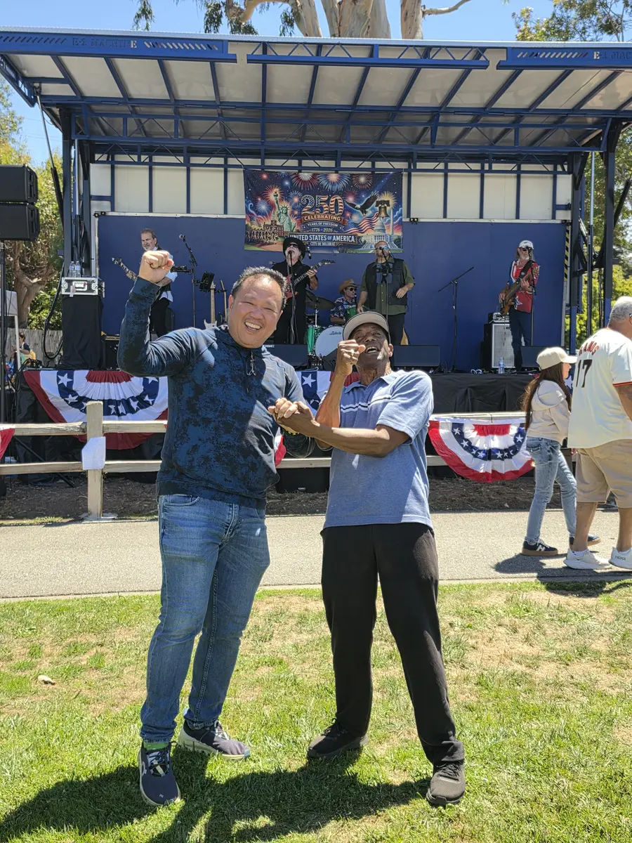 Albert with a community volunteer